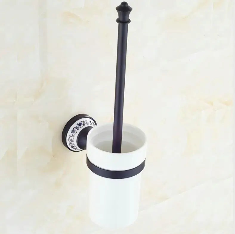 Ornate black and white bathroom accessories set featuring a wrought iron toilet brush holder with wall mount