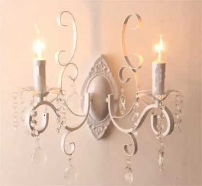 White wrought iron wall lamp with ornate scrollwork and crystal droplets perfect for decorbites black wrought iron decor