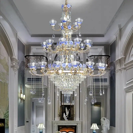 Ornate blue and gold decorbites crystal candle chandelier with crystal droplets and glass flower accents for staircase lighting