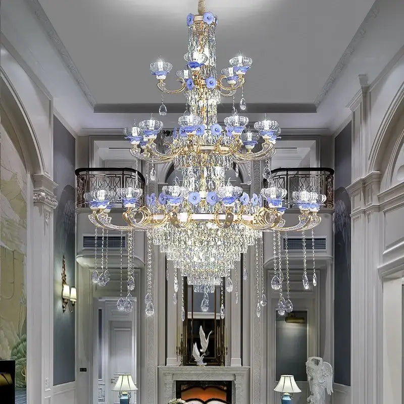 Ornate blue and gold decorbites crystal candle chandelier with crystal droplets and glass flower accents for staircase lighting