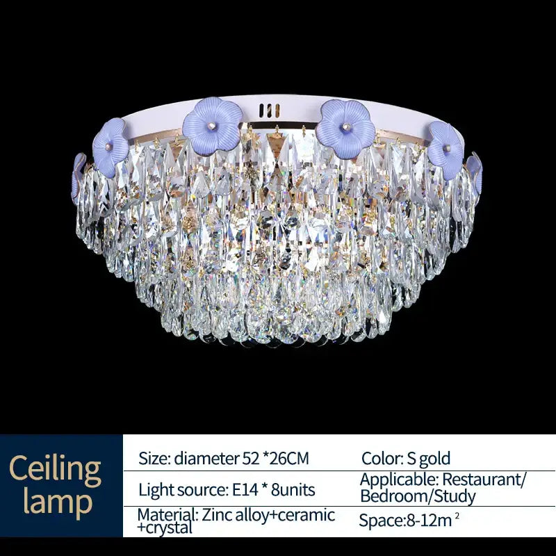 Ornate blue and gold decorbites crystal candle chandelier with circular white base and light purple floral accents for staircase lighting