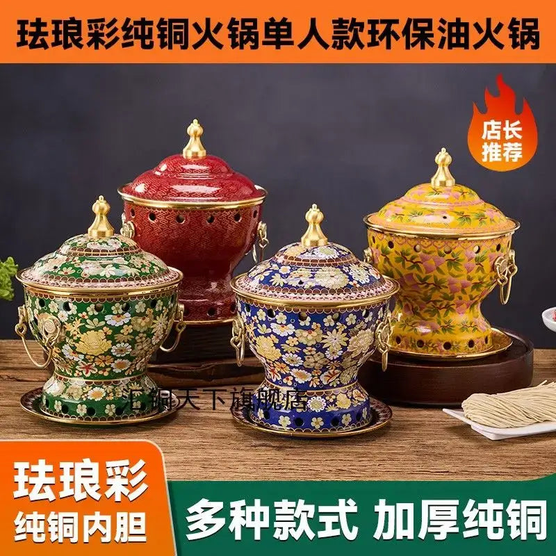 Ornate blue and white enamel copper hot pot cookware with gold-trimmed lids in vibrant red green blue and yellow patterns