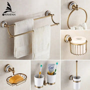 Ornate brass and white ceramic bath hardware set with decorative plates for elegant bathroom accessories and bath hardware