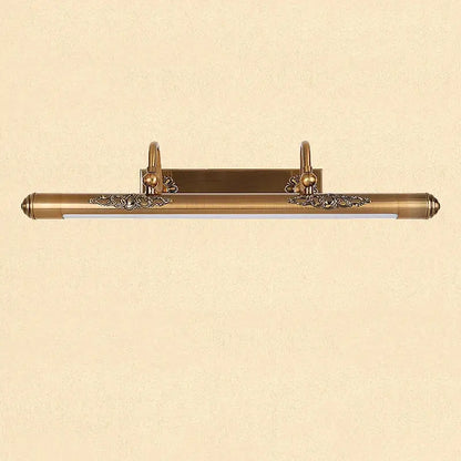 Antique brass bathroom mirror lamp with ornate floral detailing and sleek elongated rectangular design wall mounted