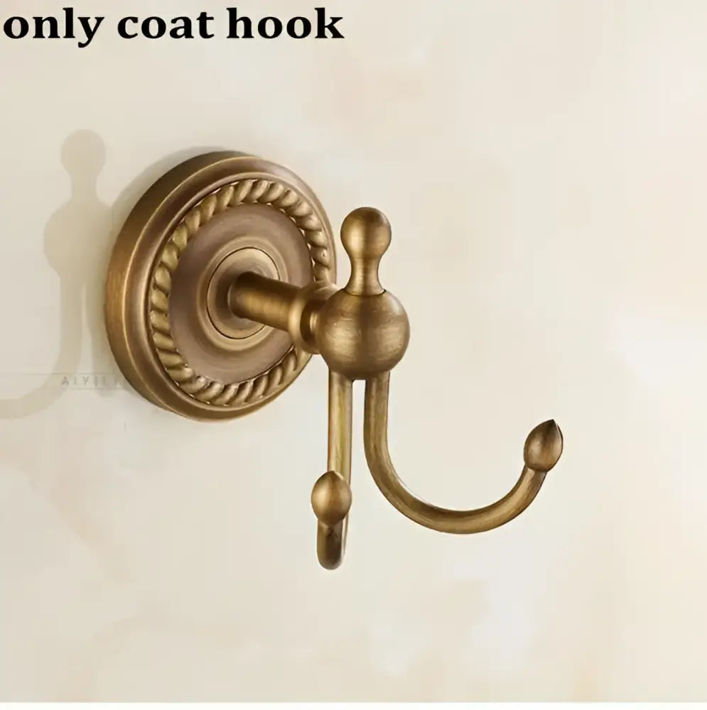 Antique brass double coat hook with ornate rope-patterned base in decorbites copper bathroom accessories set