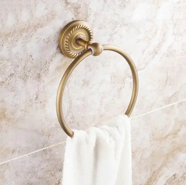 Antique brass towel ring with decorative rope-textured mounting plate and smooth hoop from copper bathroom accessories set