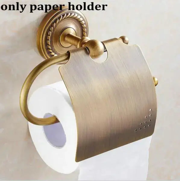 Antique brass-finished wall-mounted toilet paper holder with ornate rope-twist detailing in decorbites copper bathroom set