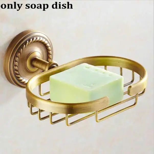 Antique brass wall-mounted soap dish with woven wire basket design holding pale green soap in decorbites copper bathroom set