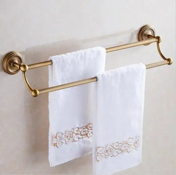 Ornate brass double towel rack with polished gold finish and rounded mounts from decorbites copper bathroom accessories set