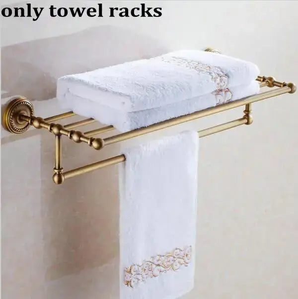 Ornate brass finished copper towel rack with floral embroidered white towels from decorbites copper bathroom accessories set