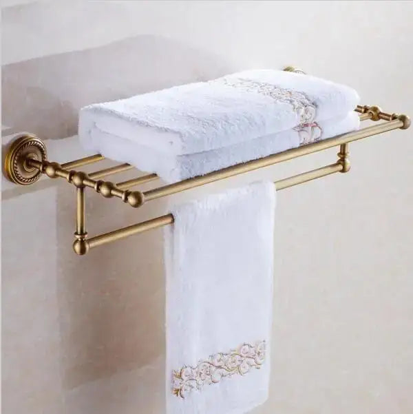 Gold-toned brass towel rack with ornate spherical finials and scrollwork in decorbites copper bathroom accessories set