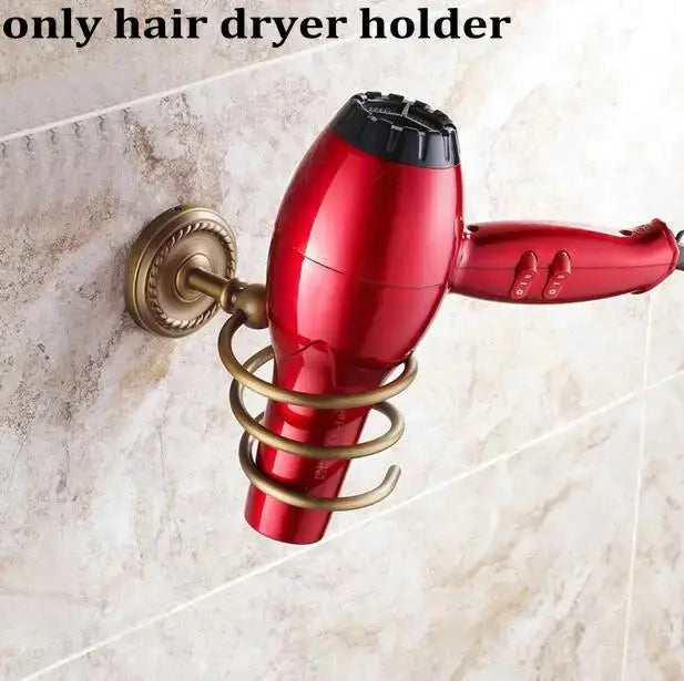 Red hair dryer with black nozzle mounted in brass finished copper spiral holder from decorbites copper bathroom accessories set