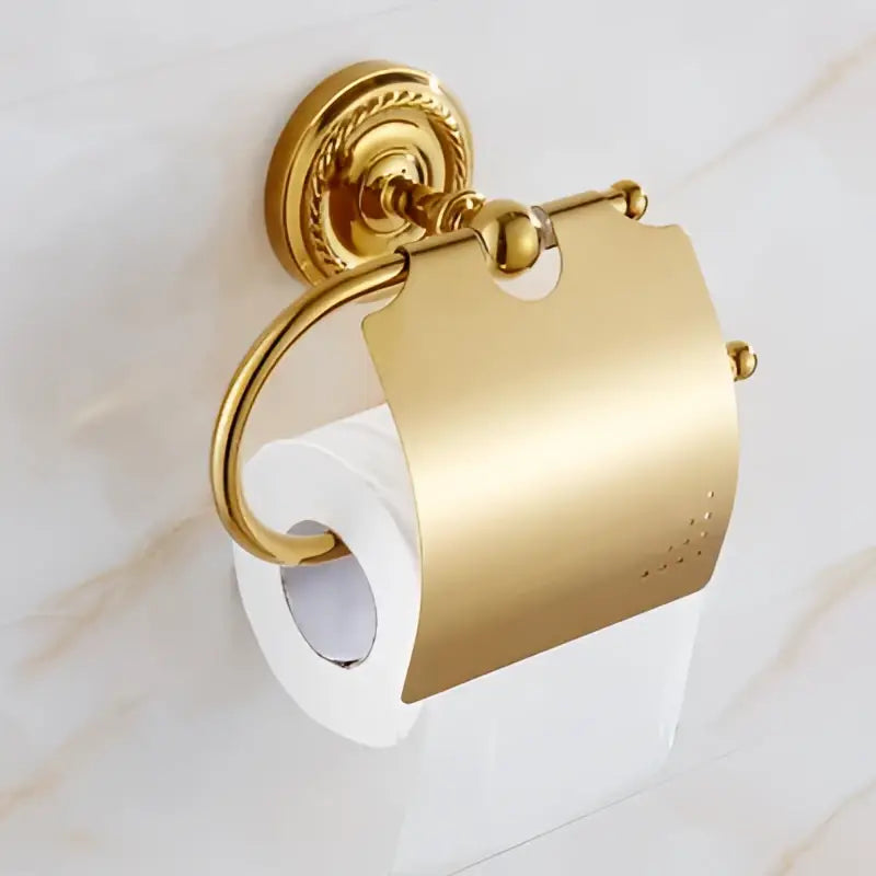 Ornate brass gold toilet paper holder with gold finish and scrollwork in decorbites brass gold bathroom hardware set