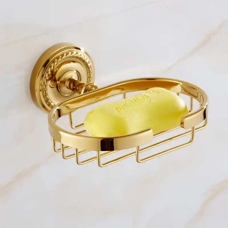 Gold-colored metal soap dish with ornate wall mount and wire mesh basket from decorbites brass gold bathroom hardware set