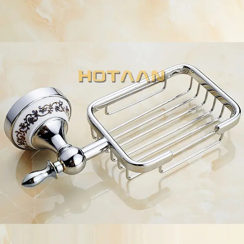 Ornate brass gold soap dish with chrome finish wire mesh and white ceramic holder featuring black floral detailing