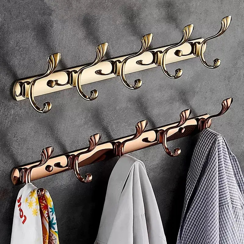 Ornate brass gold and rose gold towel hook rack with decorative scrollwork for bathroom and kitchen decorbites brass gold
