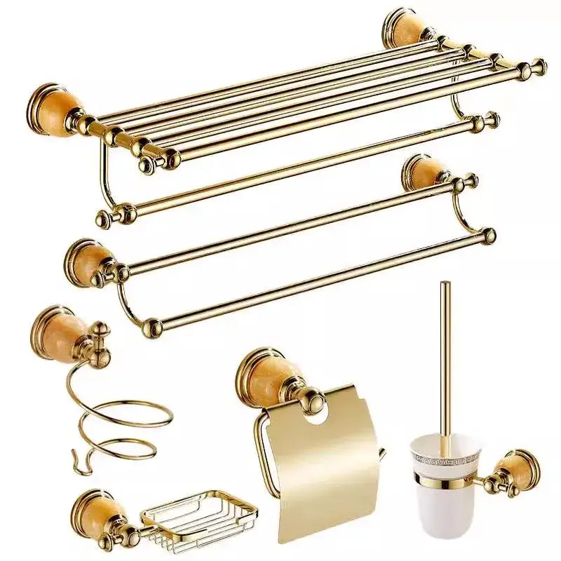 Ornate brass jade bathroom accessory set with gold-toned ceramic knobs and matching metallic amber finishes by decorbites
