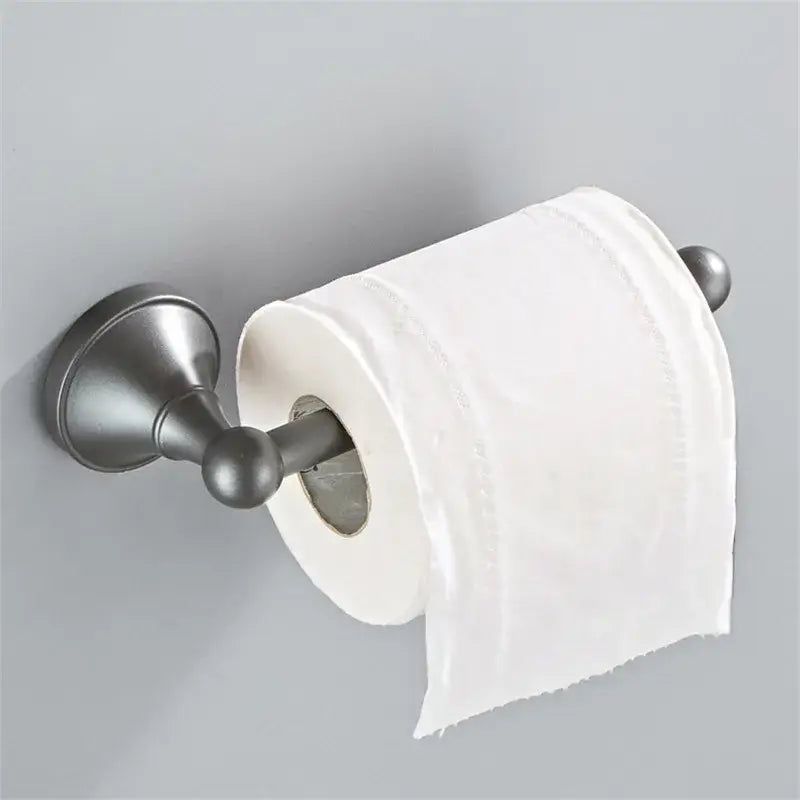 A sleek matte bronze toilet paper holder with classic design in ornate brushed nickel gray bathroom accessories set