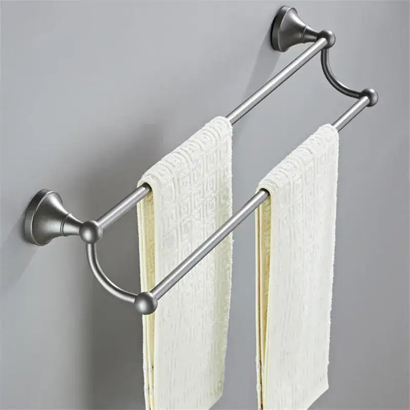 Stainless steel double towel rack with brushed finish and decorative spheres in a decorbites gray bathroom set