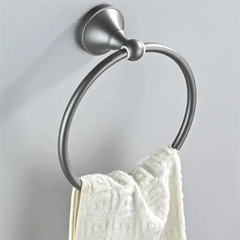 Ornate brushed nickel towel ring in gray bathroom accessories set holding a white textured towel for decorbites gray bathroom