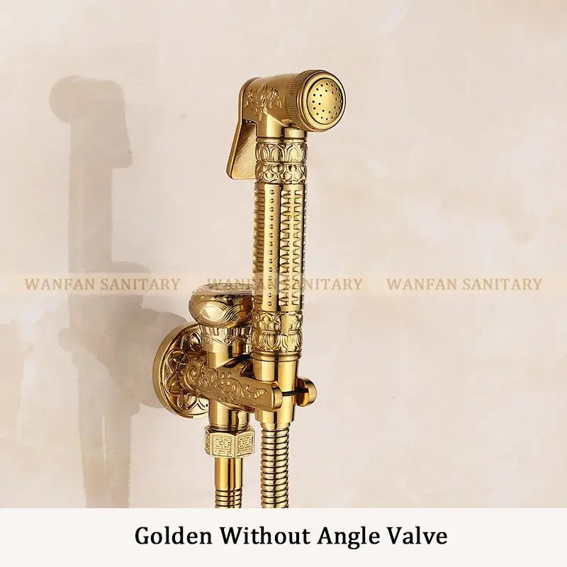 Ornate engraved gold brass wall mounted bidet faucet handheld showerhead with intricate floral embossing on decorbites brass wall bracket