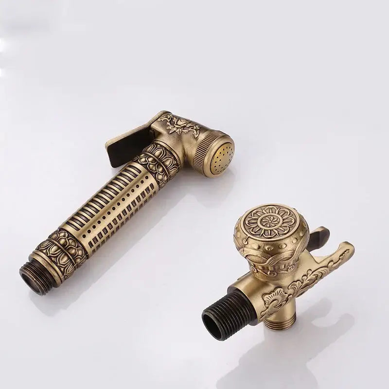 Ornate engraved gold brass wall mounted bidet faucet with intricate floral and geometric embossing decorbites brass wall