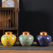 Ornate ceramic storage jar set with vibrant floral patterns and gold lids ideal for kitchen tea pot or coffee storage