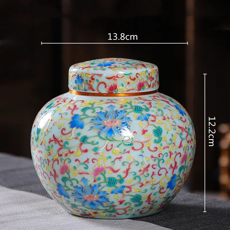 Ornate light blue ceramic storage jar with multicolored floral patterns for tea coffee kitchen use