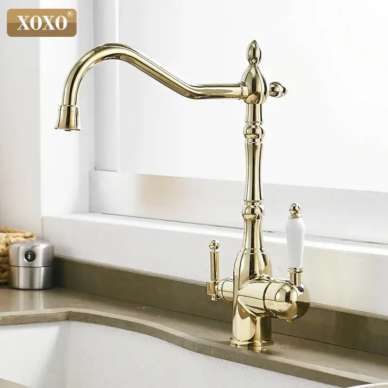 Ornate gold and white decorbites kitchen faucet mixer tap with ceramic handles and a curved spout for vintage style