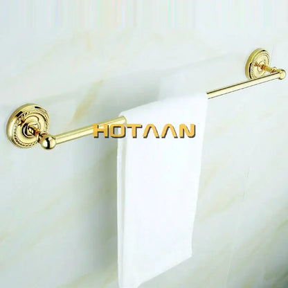 Gold-finished brass towel rack with ornate circular wall mounts from decorbites brass bathroom accessories set