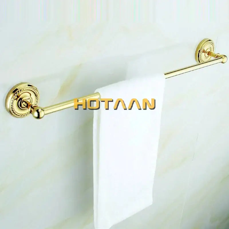 Gold-finished brass towel rack with ornate circular wall mounts from decorbites brass bathroom accessories set