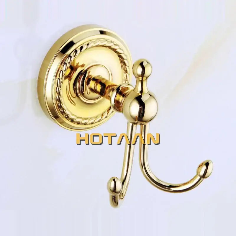 Gold-finished brass double robe hook with ornate rope-twist wall plate and polished finials from decorbites brass bathroom accessories set