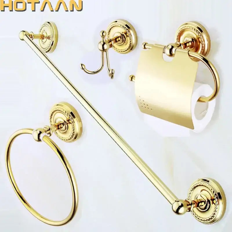Ornate gold brass bathroom accessories set with towel bar hook and toilet paper holder featuring circular wall plates