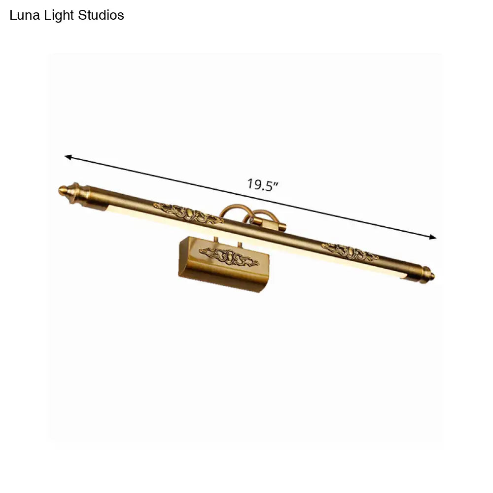 Antique brass-finished ornate gold wall vanity light with warm white illumination and floral engraving for bedroom sconce
