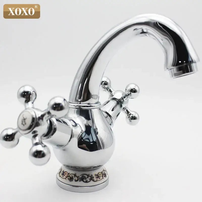 Ornate gold and chrome double handle chrome basin faucet with chrome finish xoxo brand and floral detailing