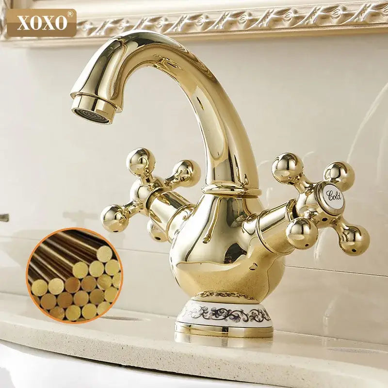 Ornate gold xoxo basin faucet with double handle chrome cross handles and decorative base for bathroom use