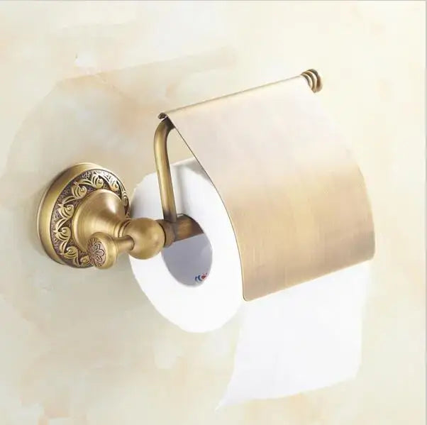 Antique brass toilet paper holder with ornate floral detailing in decorbites copper carved bathroom accessories set
