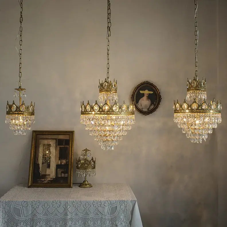 Ornate gold crown crystal led pendant light featuring three chandeliers with cascading crystal droplets for living room decorbites crystal led pendant