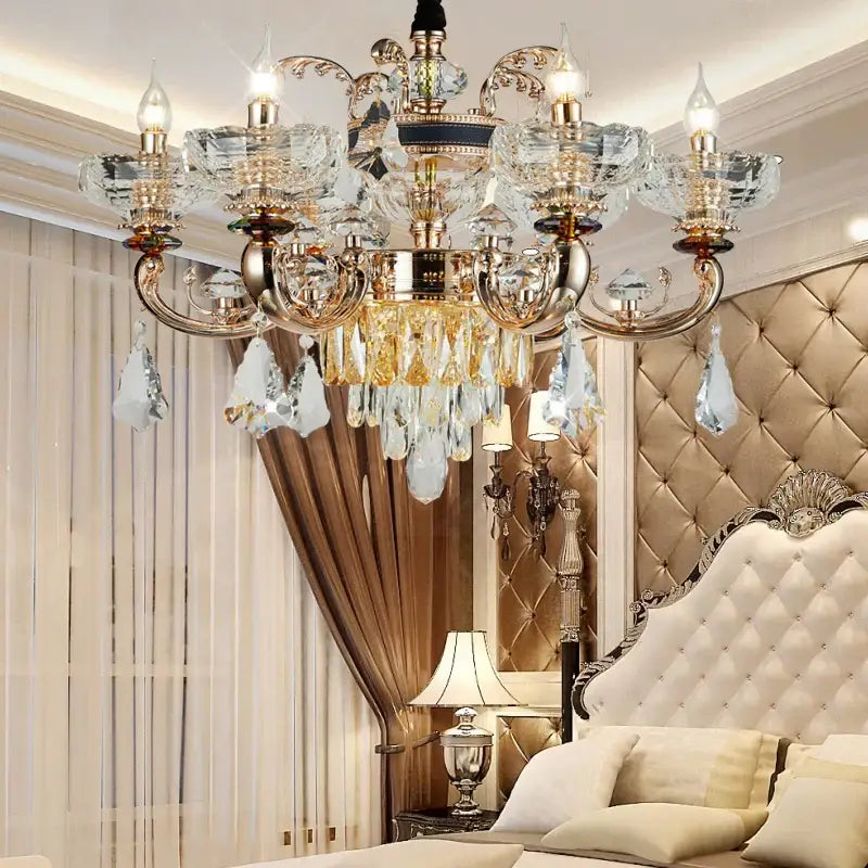 Ornate gold crystal candle chandelier with intricate detailing and teardrop crystals for dining room decorbites crystal candle