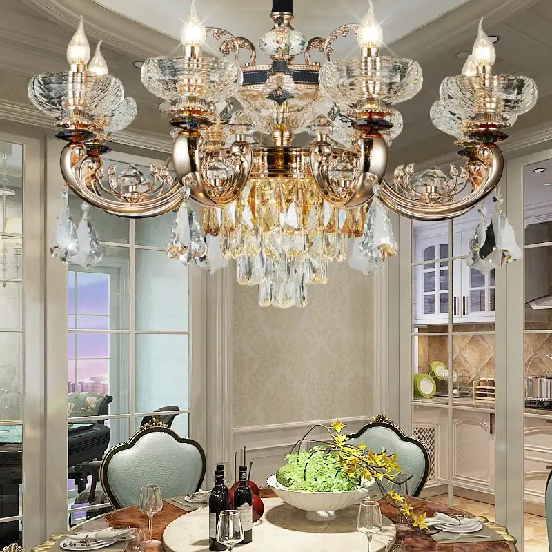 Ornate gold crystal candle chandelier featuring decorbites crystal candle design with glass droplets for dining room decor