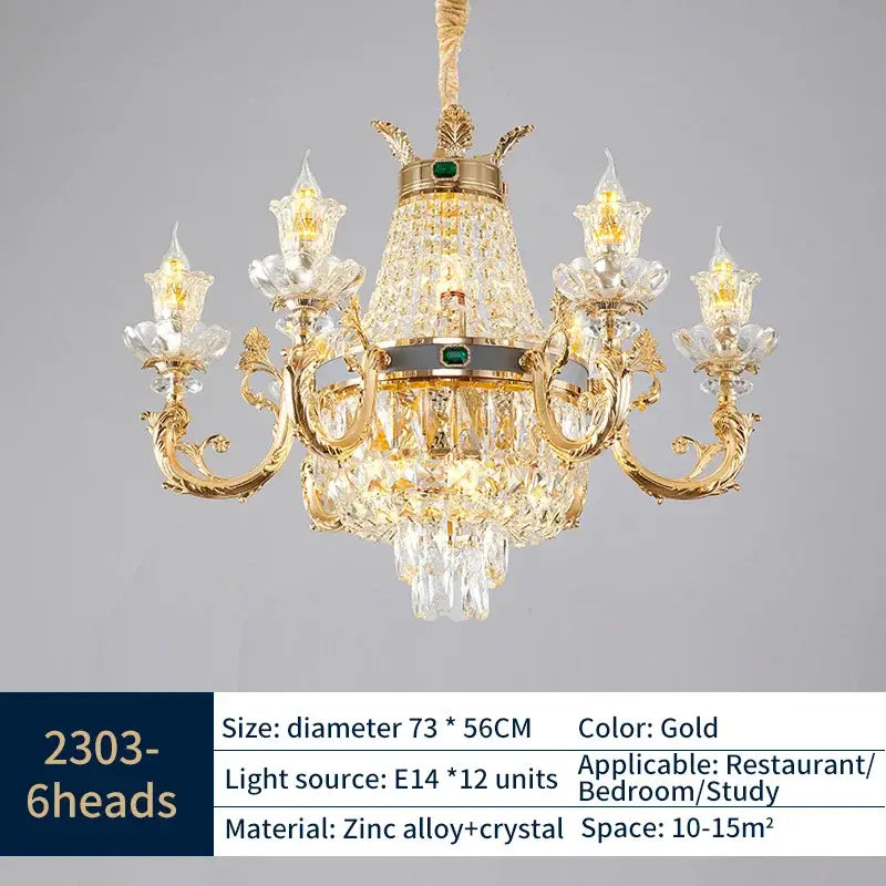 Ornate gold crystal dining room chandelier with intricate droplets and a central green gemstone accent by decorbites crystal dining