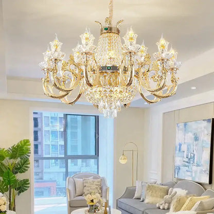 Ornate gold crystal dining room chandelier with clear droplets and central green gemstone for decorbites crystal dining decor