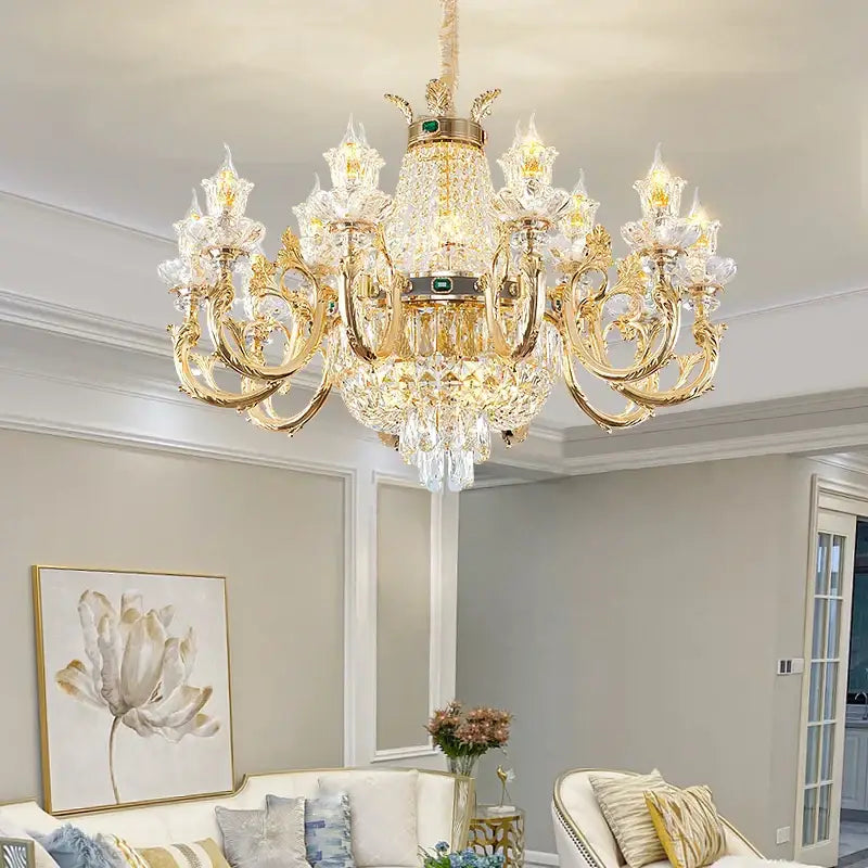Ornate gold crystal dining room chandelier with intricate crystal droplets and a central green accent stone decorbites crystal dining