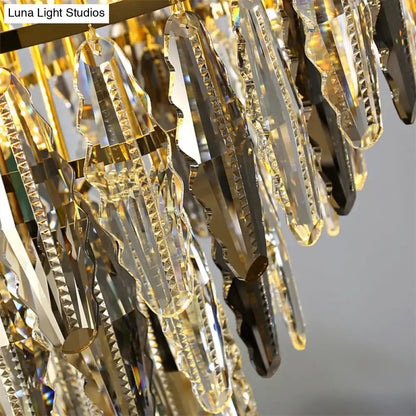 Golden minimalist crystal leaf pendant light with clear crystal prisms in cascading tiers and elegant fixture width