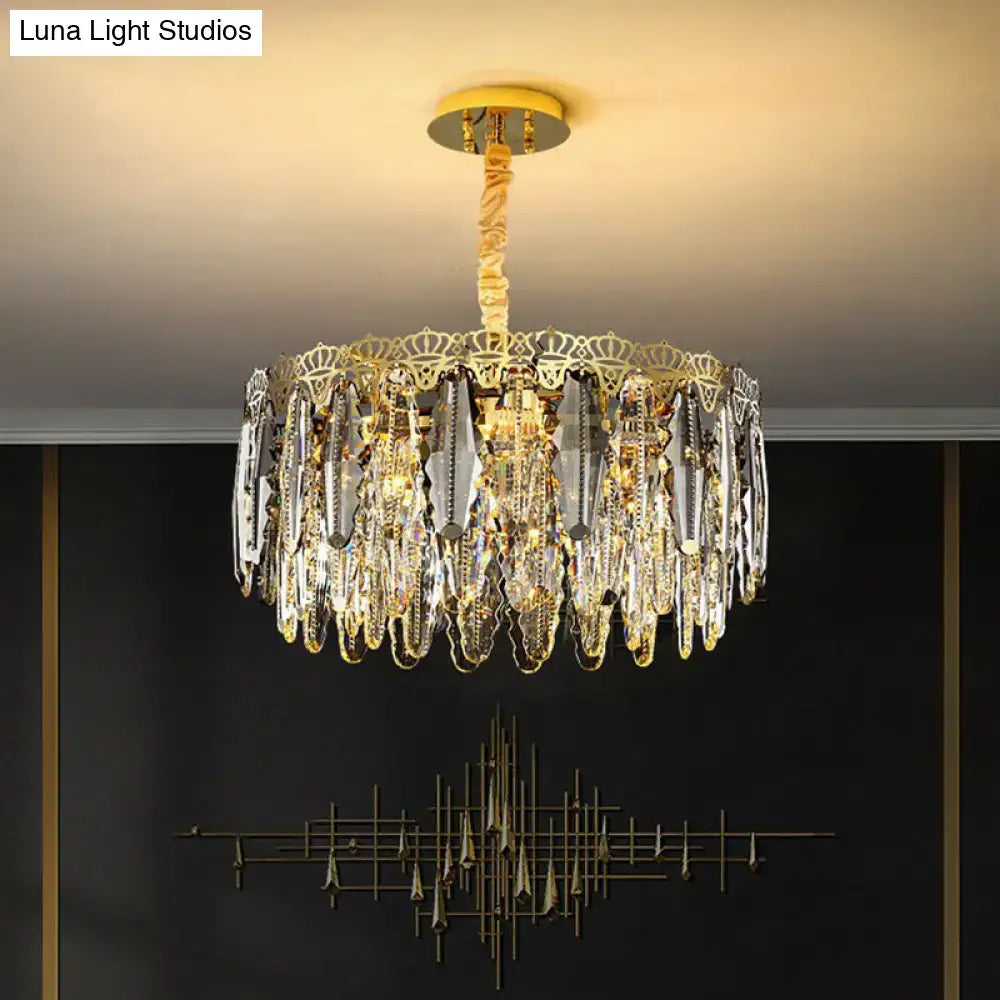 Gold-toned DecorBites™ minimalist crystal leaf pendant light with clear crystal prisms and ornate metalwork fixture width
