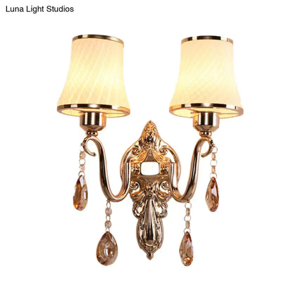 Ornate gold crystal wall sconce with two cream fabric shades and amber crystals for e26 e27 bulb base lighting