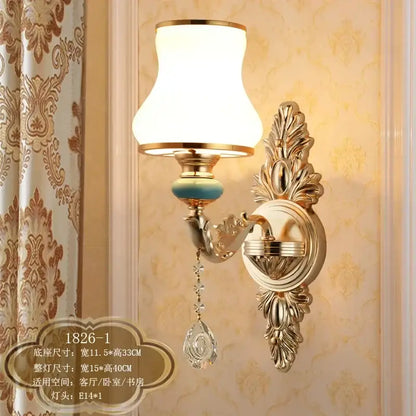 Ornate gold crystal wall sconce with frosted white shade turquoise bead and dangling crystal teardrop decorbites crystal wall