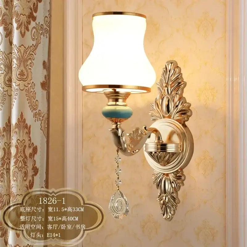 Ornate gold crystal wall sconce with frosted white shade turquoise bead and dangling crystal teardrop decorbites crystal wall