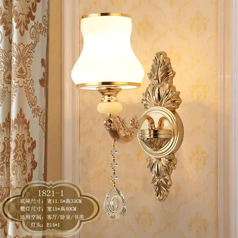 Ornate gold crystal wall sconce with frosted glass shade and dangling teardrop pendant for elegant decorbites crystal wall lighting