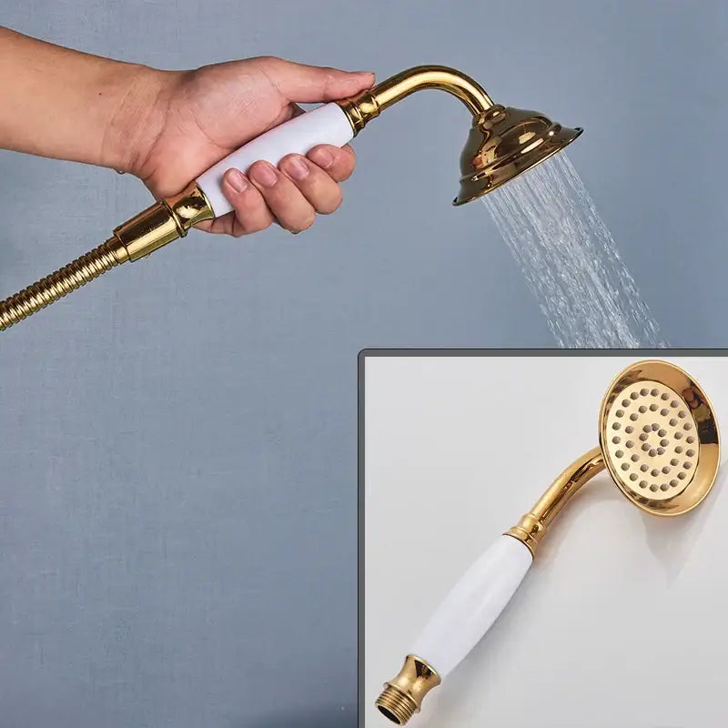 Ornate gold swan freestanding bathtub faucet handshower with gold-finished handheld showerhead and white ceramic handle